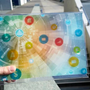 Hand holding futuristic device with digital icons